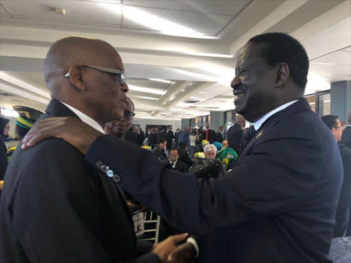 Opposition leader Raila Odinga with South Africa's deputy president H.E David Mabuza at the funeral of Winnie Mandela in South Africa on April 14./COURTESY