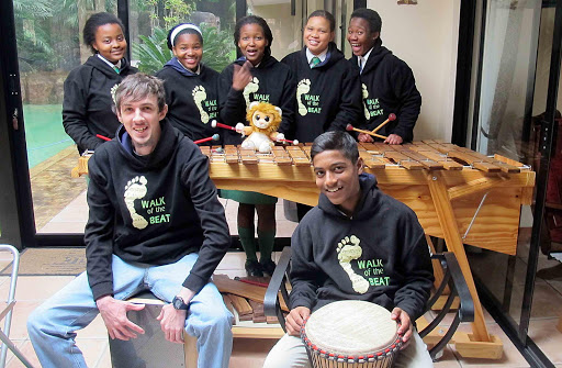 HEEDING THE MUSE: Walk of the Beat band members (back from left) Anelisa Ramza, Noluthando Eleni, Othembela Mbombo, Budlelwana Botwana and Yamkela Rawutini have jumped at the opportunity to play the marimba again, thanks to their coach Robin Gower, front left. Lirushan Pillay of Merrifield is on the djembe drum Picture: BARBARA HOLLANDS