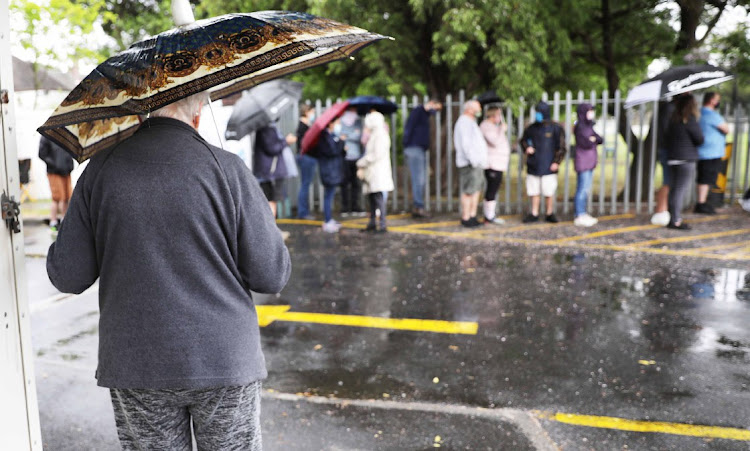 Rain coats and umbrellas were the order of the day in Pinelands, Cape Town.