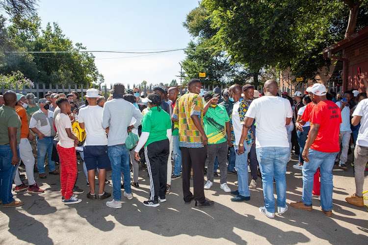 Parents and political parties protested outside Hoërskool Jan Viljoen on February 14 2022.