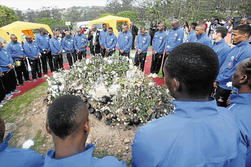 South Africa's Bafana Bafana national soccer team players visited the grave of their slain captain, Senzo Meyiwa, at Heroes Acre cemetery in Chesterville, Durban, on November 10, 2014 ahead of their Africa Cup of Nations penultimate qualifying match against Sudan at the Moses Mabhida Stadium.