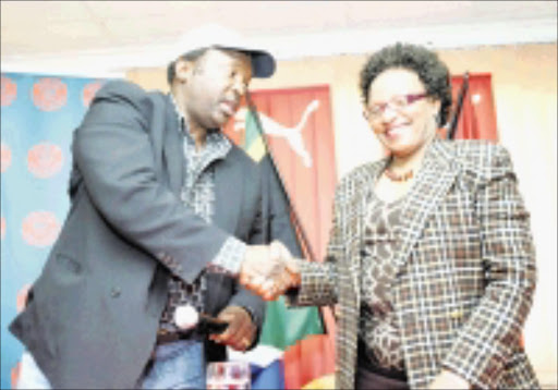 DEAL: Jomo Cosmos boss Jomo Sono with Vaal University of Technology vice chancellor Irene Moutlana during a press conference yesterday. Pic. Veli Nhlapo. 08/09/08. © Sowetan.