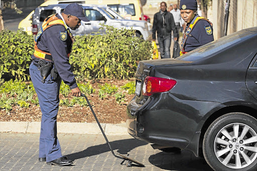 A car entering the Mediclinic Heart Hospital in Pretoria gets the full treatment from the security police
