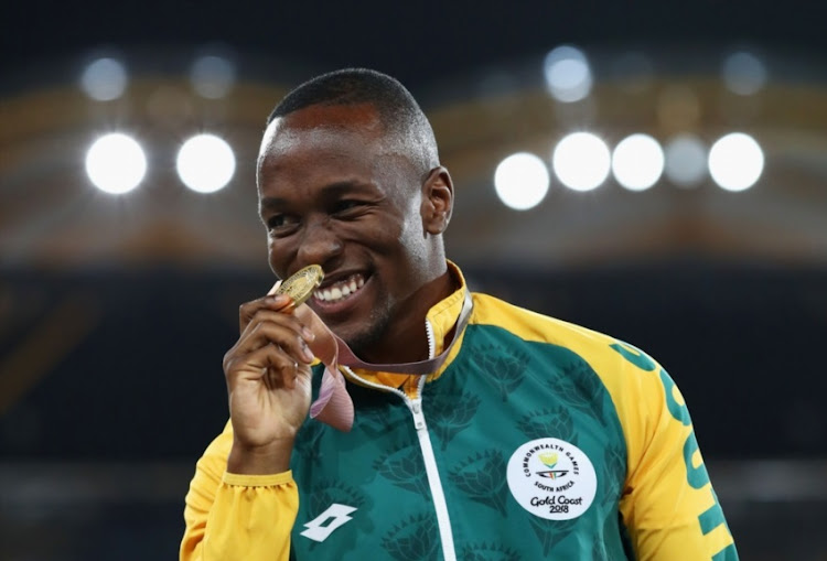 Gold medalist Akani Simbine of South Africa celebrates during the medal ceremony for the Mens 100 metres during the Athletics on day six of the Gold Coast 2018 Commonwealth Games at Carrara Stadium on April 10, 2018 on the Gold Coast, Australia.