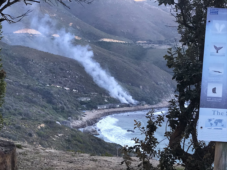 Smoke rises from Tintswalo Atlantic, in Hout Bay, early on February 5 2019.