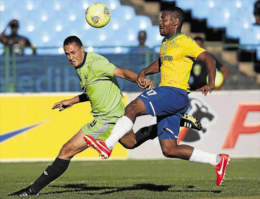 Method Mwanjale, right, of Mamelodi Sundowns fights for possession against Henrico Botes of Platinum Stars during the Nedbank Cup quarterfinal at Loftus Versfeld, Pretoria yesterday. Stars won 2-1 to reach the semifinal