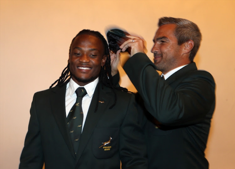 Seabelo Senatla receiving a cap for 35 tournaments from Neil Powell during the Springbok Sevens Year End Function and Capping Ceremony at Southern Sun Hotel Cape Sun on December 13, 2017 in Cape Town, South Africa.