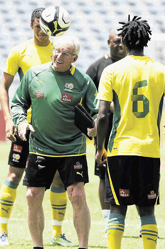 Bafana Bafana coach Gordon Igesund in light-hearted mood with some of his players during a training session at Orlando Stadium.