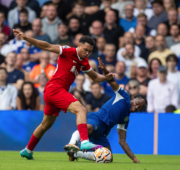 Liverpool's Trent Alexander-Arnold (L) vies for the ball with Chelsea's Raheem Sterling