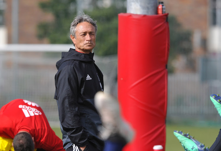 Ajax Cape Town head caoch Muhsin Ertugral takes charge of a training session.