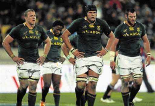 Springbok players look dejected during the Tri-Nations match against the All Blacks in Wellington on Saturday. The home side had just scored another try on their way to a 40-7 hammering of the Boks Picture: PHIL WALTER/GALLO IMAGES