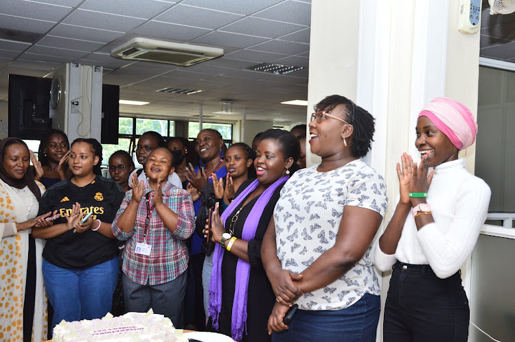 Radio Africa Group staff converge for cake-cutting ceremony to mark International Women's Day on March 8, 2024.