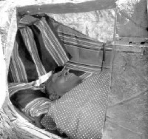 HEART RHYTHM: Samson Mudzunga lies inside his drum. © Unknown.