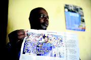 WAITING: Mpumelelo Nkayi holds up a picture of prophet Samuel Radebe. Nkayi is owed R100 000 by the Revelation Church of God after he won a CCMA case  against them. Photo: Thulani Mbele