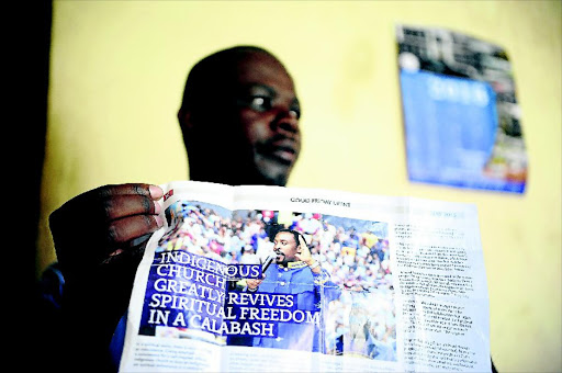 WAITING: Mpumelelo Nkayi holds up a picture of prophet Samuel Radebe. Nkayi is owed R100 000 by the Revelation Church of God after he won a CCMA case against them. Photo: Thulani Mbele