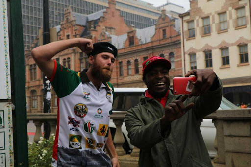 'Multi-party' protestor Johan van der Merwe poses for a selfie with an EFF member Picture: KYLE COWAN