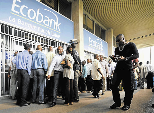 POPULAR: A queue at an Ecobank Transnational branch in Abidjan, Ivory Coast, one of the three dozen countries served by the Togo-based bank in which Nedbank has bought a 20% stake for R5-billion