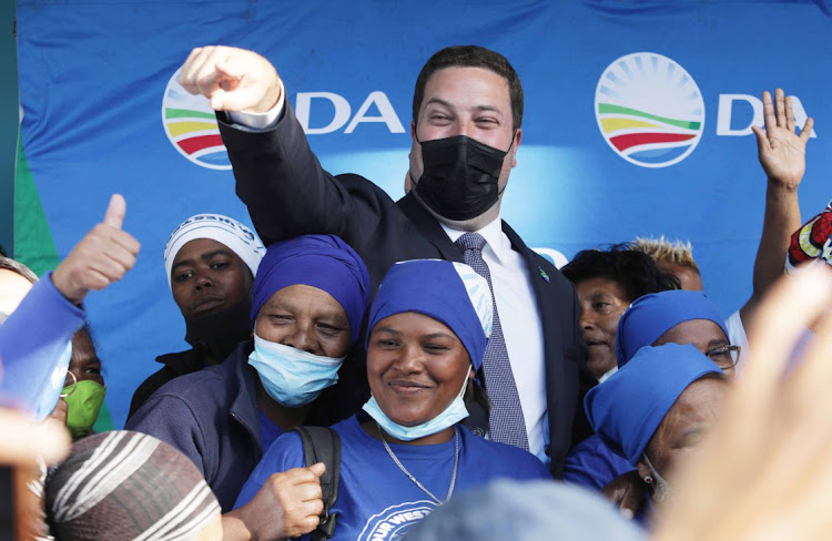 Democratic Alliance Cape Town mayoral candidate Geordin Hill-Lewis celebrates with supporters in Athlone at the Cape Flats after winning Cape Town on Wednesday.