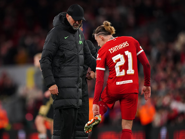 Liverpool manager Jurgen Klopp talks to Kostas Tsimikas during their Uefa Europa League round of 16, second leg match against Sparta Prague at Anfield, Liverpool.