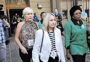 HARD EVIDENCE: June Steenkamp, Reeva's mother, centre, leaves the Pretoria High Court yesterday after listening to unhappy messages her daughter sent murder accused Oscar Pistorius