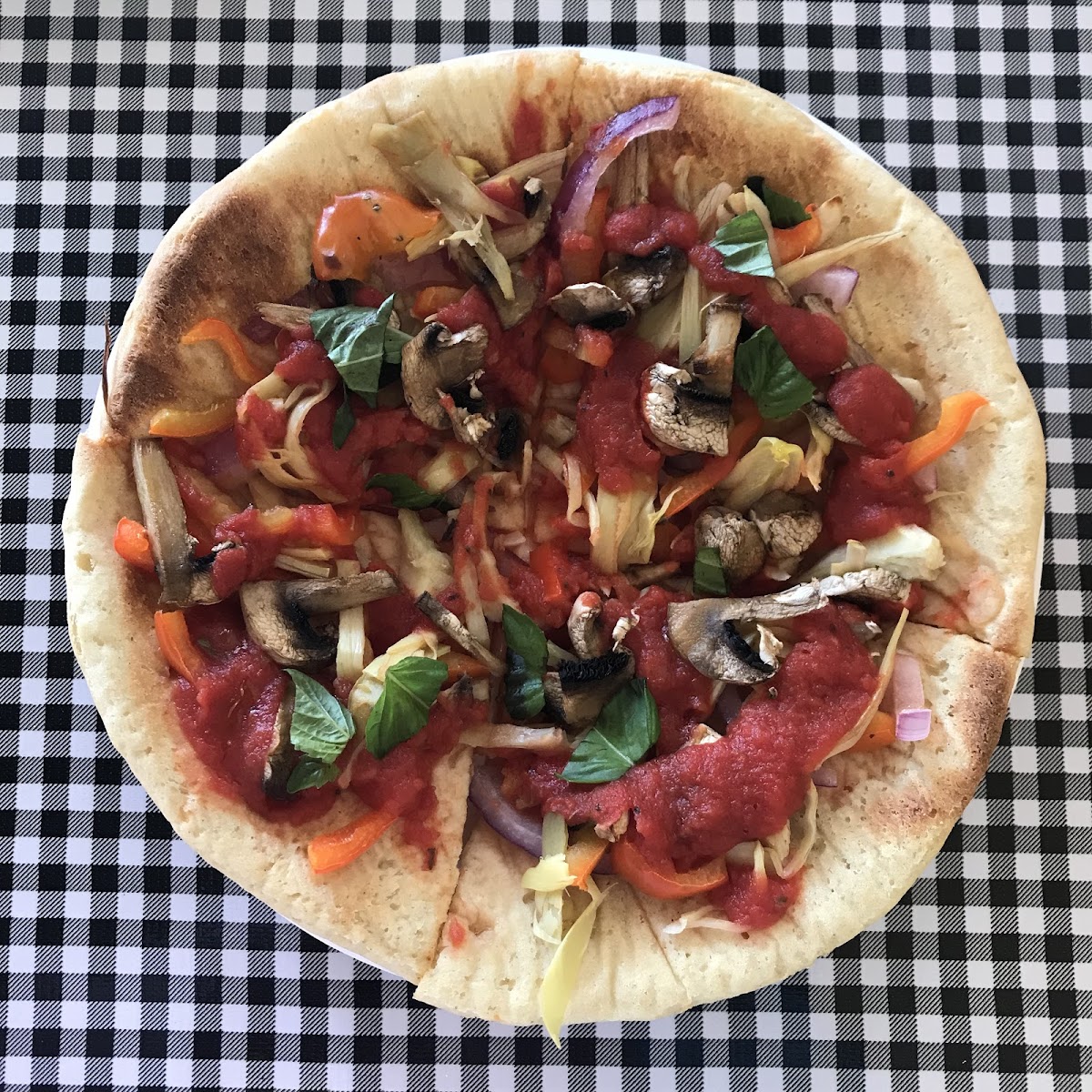 I’m a vegan so mine didn’t have cheese, but my partner had the cheese and said it was tasty. Love when I find a homemade GF pizza crust in random small towns.