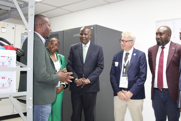 Data Center manager Jashon Otiende pitches to Zambia minister of technology and innovation Felix Mutati, Liquid Intelligent Technology and innovation officer Ben Roberts and Africa Data Center CEO Dan Kwach during a benchmarking tour of the facility at Africa Data Centre, Nairobi on April 23, 2024.