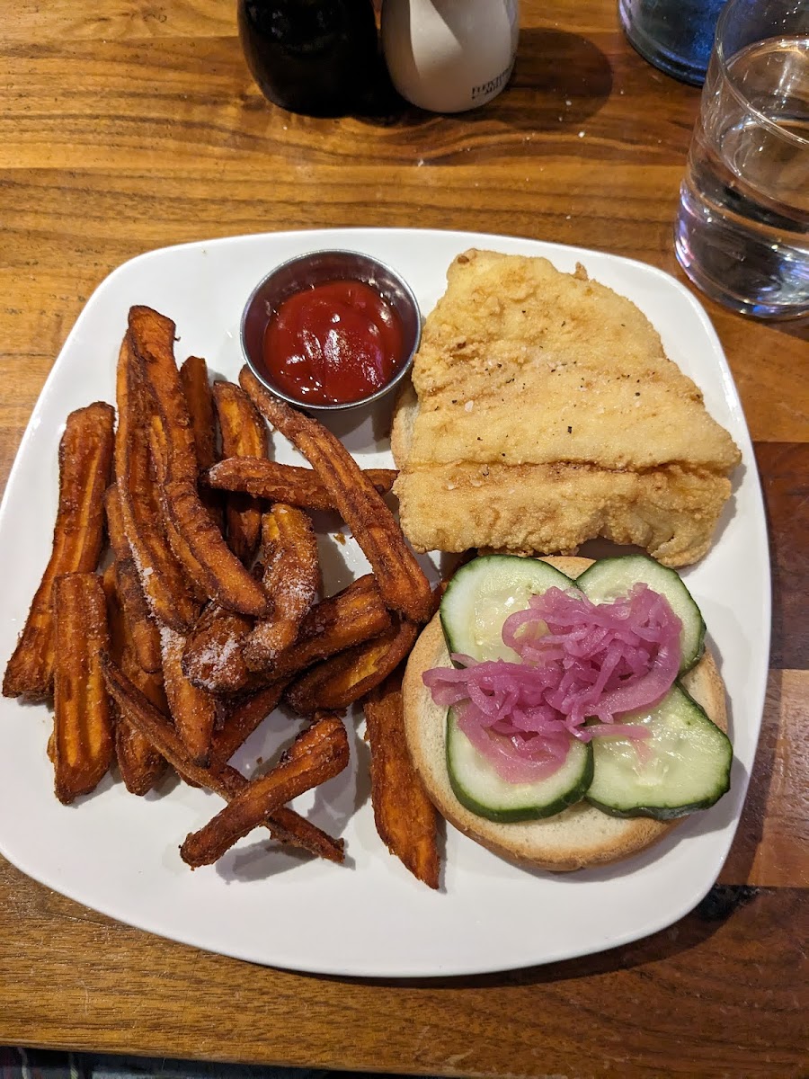 Sweet potato fries, fried fish sandwich with pickled radish, pickles, tartar sauce