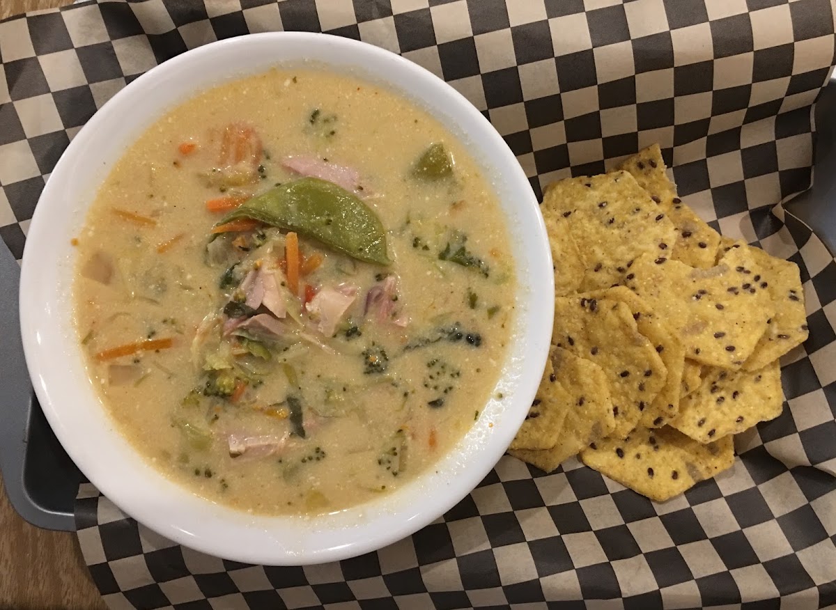 Thai Coconut Soup with Chicken and Veggies. Served with gluten free chips. They are famous for this soup! So delicious!