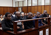 Lindokuhle Thabani Mkhwanazi, left and Siyanda Eddie Myeza, middle, had their bail applications heard in the Durban magistrate's court on Thursday.