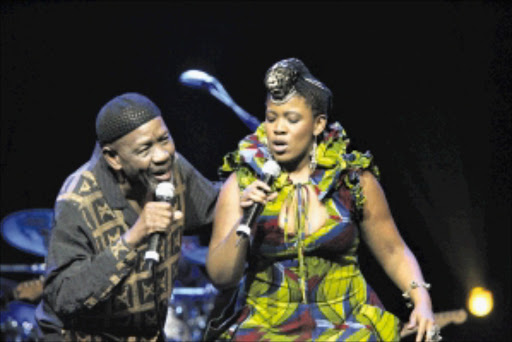 ON THE RIGHT TRACK: Caiphus Semenya and Thandiswa Mazwai. Pic. Veli Nhlapo. 25/04/2010. © Sowetan. 2010425VNH. Caiphus Semenya & Thandiswa Mazwai Legend & Legacy Live DVD Recording concert ,Carnival City.PHOTO:VELI NHLAPO.