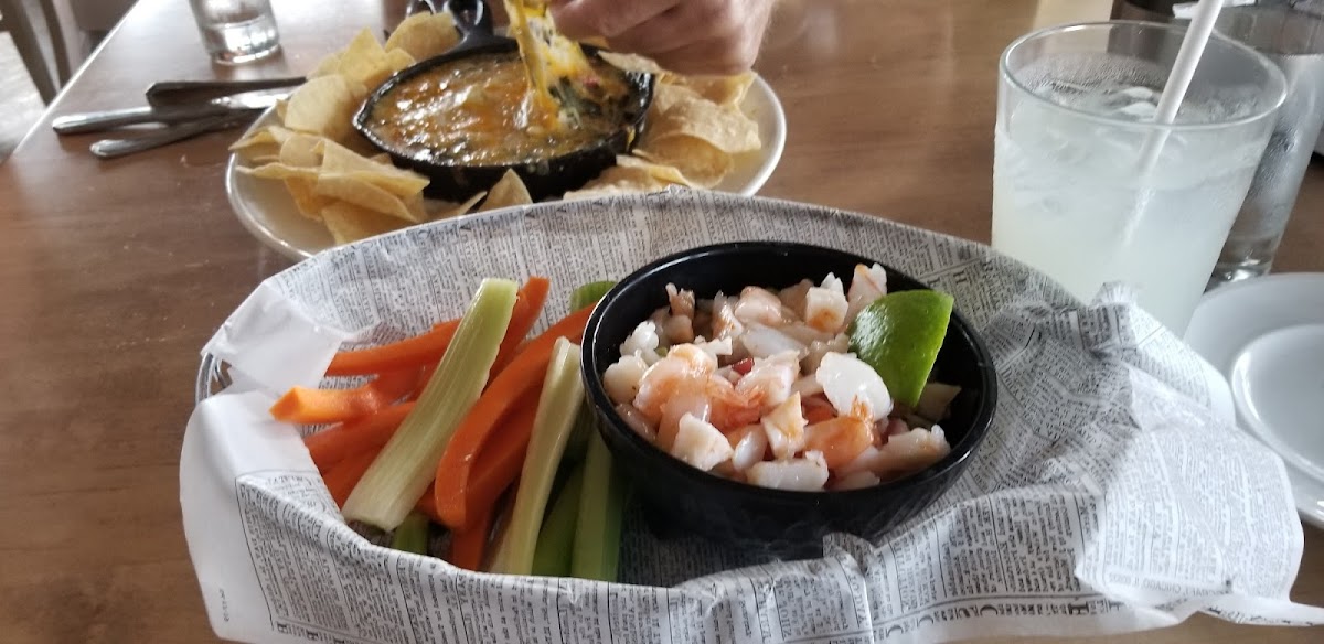 Specialty shrimp guacamole, GF version has carrot sticks and celery instead of the chips.