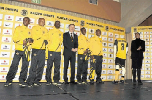 NO DUMMIES: Chiefs' new coach Stuart Baxter is flanked by new players while marketing director Jessica Motaung stands next to a mannequin wearing Mulomowandau Mathoho's jersey. Photo: Lefty Shivambu/Gallo Images