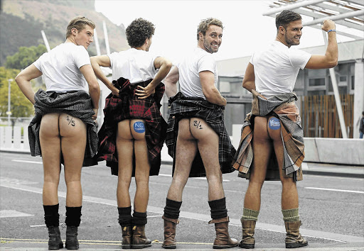 OFF KILTER: Male models display the betting odds for the Scottish independence referendum in a publicity stunt organised by a bookmaker outside the Scottish parliament building in Edinburgh. The vote takes place today