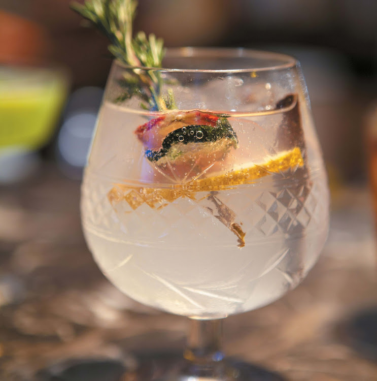 THE HEART Double shot Amber Inverroche gin 2 whole cloves 150ml Fever-tree light tonic Sprig of rosemary Halved strawberries Orange slice Mix and serve in crystal brandy goblet