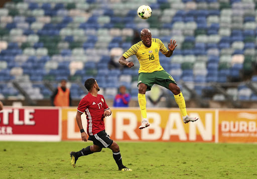 Bafana Bafana's Sifiso Hlanti heads the ball with Libya's Anias Sabbouof during their Africa Cup of Nations qualifier at Moses Mabhida Stadium in Durban.