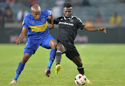 Lebogang Manyama of Cape Town City and Bernard Morrison of Orlando Pirates during the Absa Premiership match between Orlando Pirates and Cape Town City at Orlando Stadium on September 20, 2016 in Soweto, South Africa.