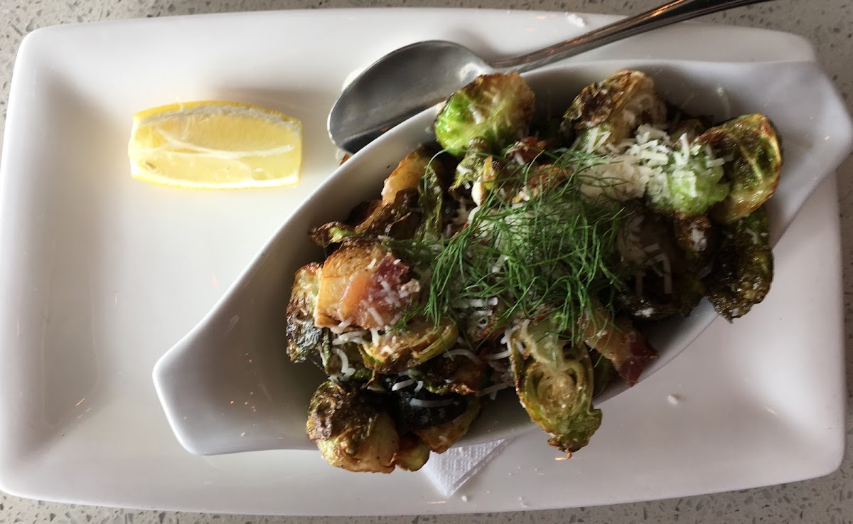 Crispy Brussels Sprouts (Appetizer) with Parmesan cheese, bacon and garlic.