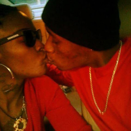 Lashonda Williams and Roger Reed kissing in the pastor's car.