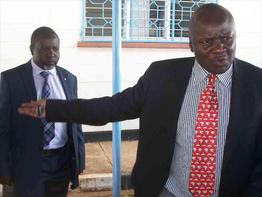 Caption lawyer Henry Makhakara (IN RED TIE)with Bungoma county Roads CEC Stephen Nendela after walking out of a house Bungoma county assembly house committee on the 4t of June 1014.PHOTOS JOHN NALIANYA