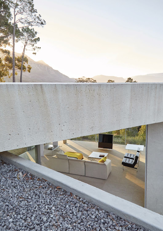 The living room is a light-filled pavilion that has impressive views outwards towards False Bay.