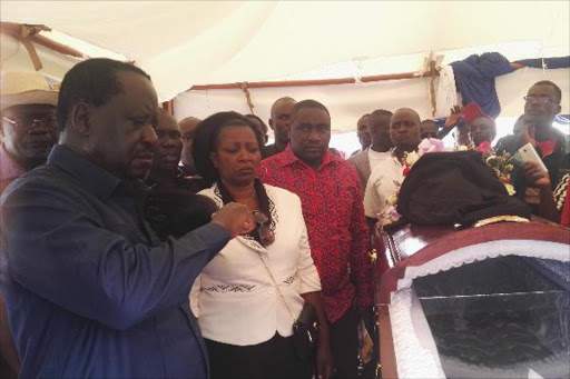 ODM party leader Raila Odinga at the funeral service of the former Harambee Stars assistant coach James Aggrey Siang'a at Siaya in Sifuyo on Saturday. /LAMECK BARAZA