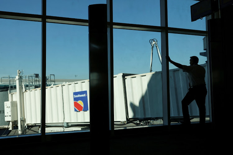 A Southwest pilot talks on his phone in Houston, Texas, the US, February 20 2019. Picture: Reuters/Mike Blake