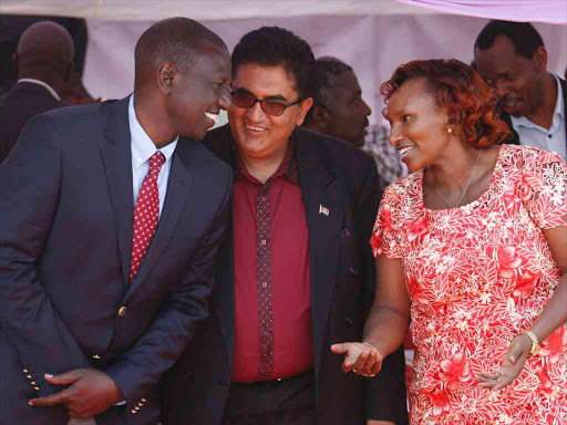 DP William Ruto chats with Imenti North Raheem Dawood and Meru women Rep Florence Kajuju during a church service at Kaaga methodist church on Sunday.pic\Charles Kimani\DPPS