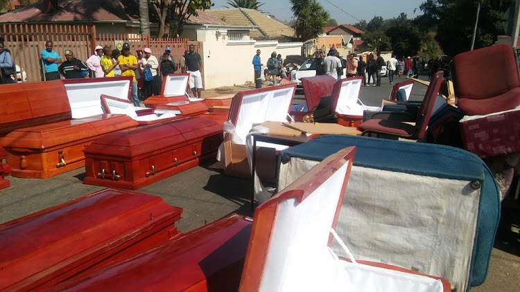 Coffins found at a house suspected of being used by drug dealers in Orange Grove.