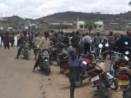 Travellers stranded at the banks of Kalemorok seasonal river in Turkana county, March 16, 2018. /HESBOUN ETYANG