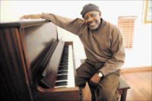 South African living music legend Caiphus Semenya the composor and singer pose next to a piano the instrument he use for composing. Pic: Tsheko Kabasia. CIRCA AUG.2009. © SUNDAY WORLD