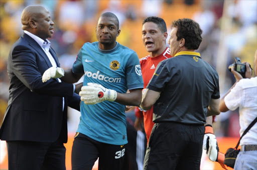 A file photo of Kaizer Chiefs football manager Bobby Motaung (wearing a suit) and goalkeeper Itumeleng Khune during the Absa Premiership match between Orlando Pirates and Chiefs at Soccer City.