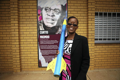 PROUD PRINCIPAL: Lindiwe Ndzala holds a rocket created by pupils at the Curtis Nkondo School of Specialisation in Soweto, Johannesburg. The school offers top pupils access to specialised learning in science, technology and engineering.