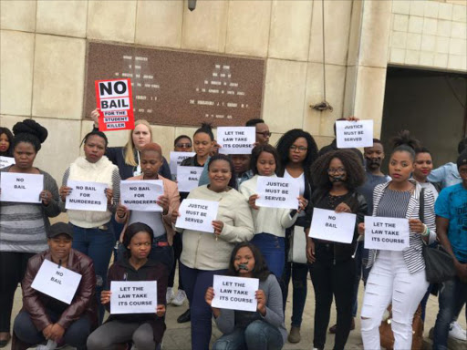 University of Fort Hare students conduct a silent protest outside the East London Magistrates Court Picture: ZWANGA MUKHUTHU
