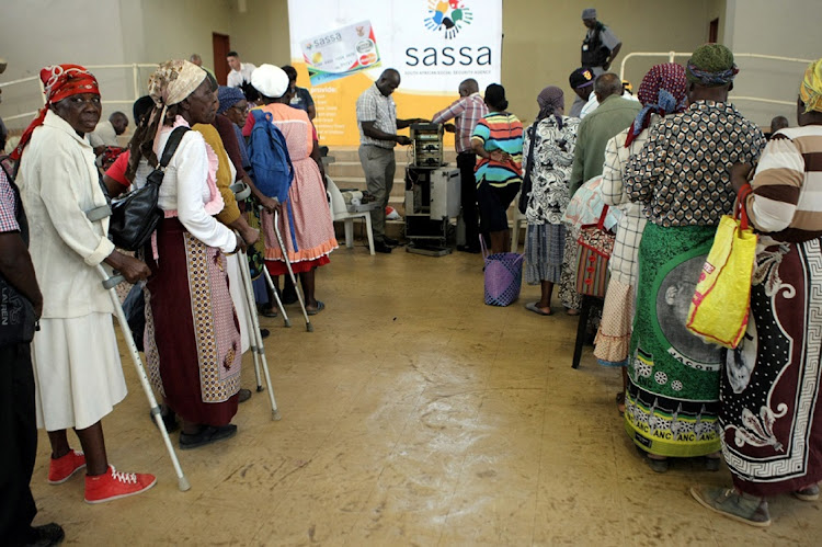 Pensioners queue to collect their grants at a Sassa pay point in Jeppes Reef, Mpumalanga. Picture: SANDILE NDLOVU